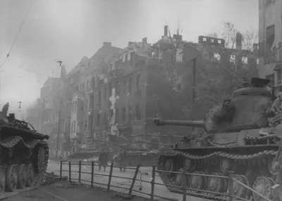 A column of Soviet heavy IS-2 tanks on the streets of Berlin