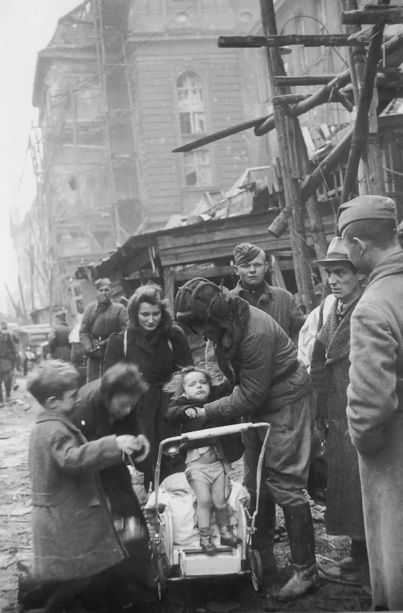 Berliners meeting Soviet soldiers on Monbijou Strasse in central Berlin