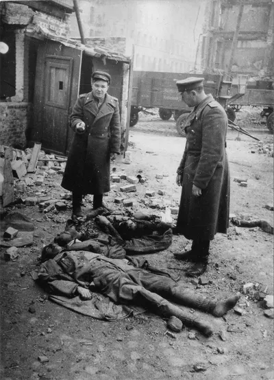 Soviet officers next to the bodies of a dead company commander and Volkssturm fighter