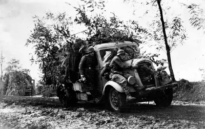 German re-enforcements (with a press photographer) are shuttled to the frontlines