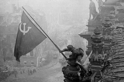 The raising of the Soviet flag on the Reichstag - captured by photographer Yevgeny Khaldei
