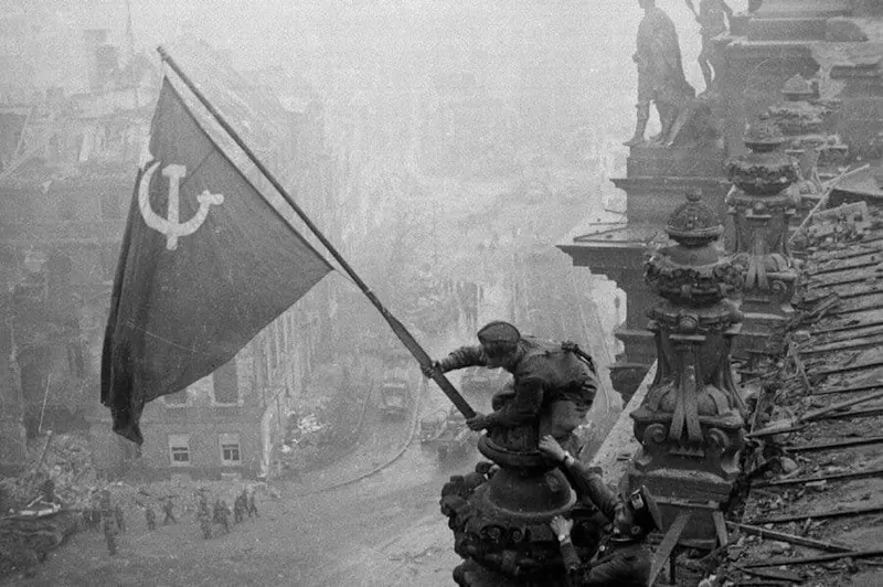 The raising of the Soviet flag on the Reichstag - captured by photographer Yevgeny Khaldei