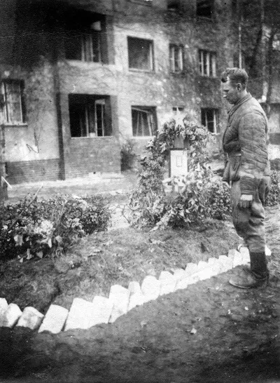 Soviet soldier, Ivan Kichigin, at the grave of his fellow soldier, Gregori Kozlov - May 1945, Berlin