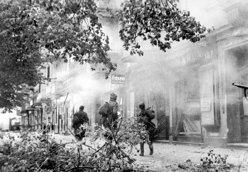 Soviet infantry moving through the streets of Berlin