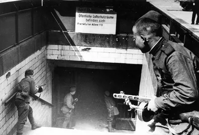 A posed photo of Soviet soldiers entering the Frankfurter Alle underground
