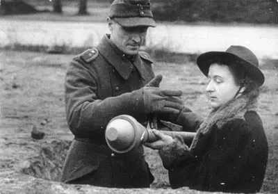 A German woman is instructed in how to use a Panzerfaust
