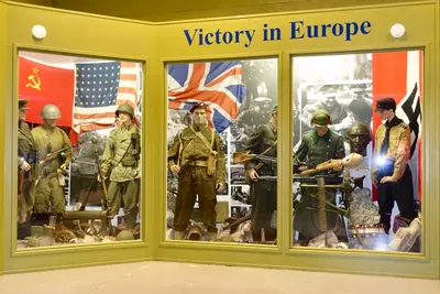 Arquebus Krigshistorisk Museum Norway. WW2 Allied Victory in Europe display. Uniforms weapons equipment USSR Red Army officer private US private British paratrooper battle dress German Waffen-SS Volkssturm Hitlerjugend flags photos A